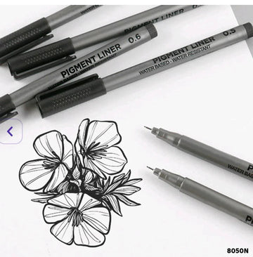 A set of precision pigment liner pens with black ink, displayed alongside a drawing of a flower on paper. The pens have precision tips, ergonomic grips, and are smudge-proof, waterproof, and fade-resistant.